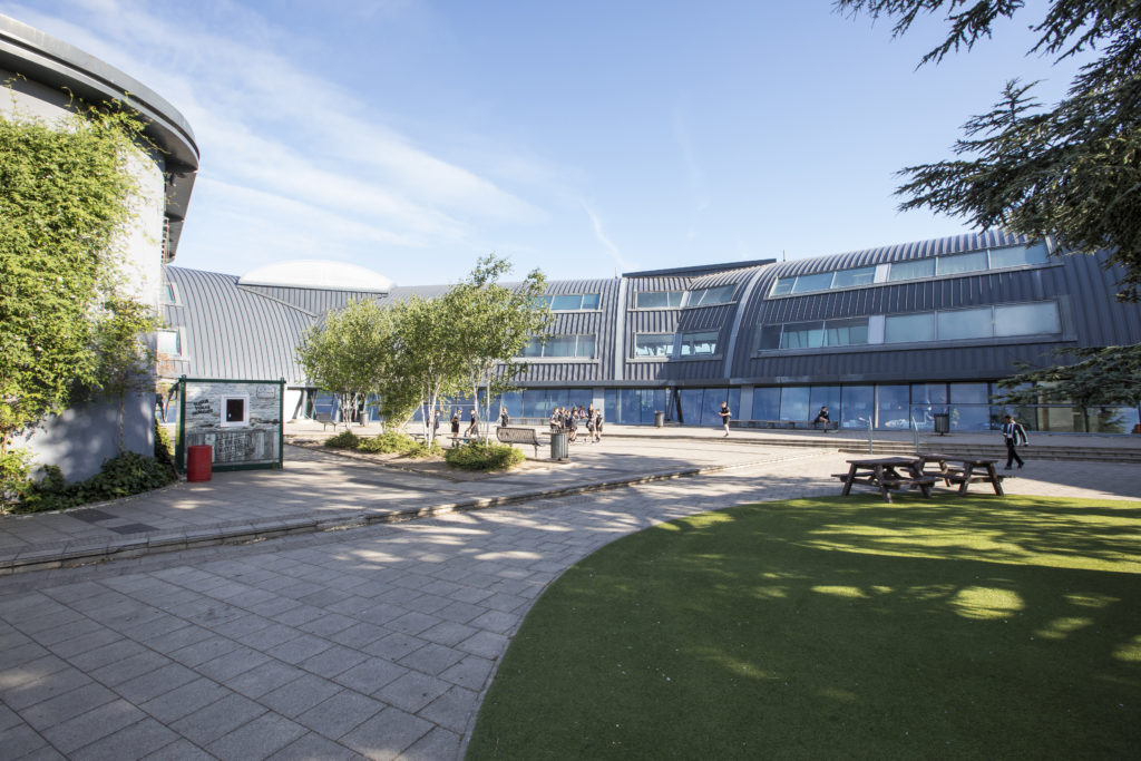 A photo of the outside of a part of The Leigh Academy building.